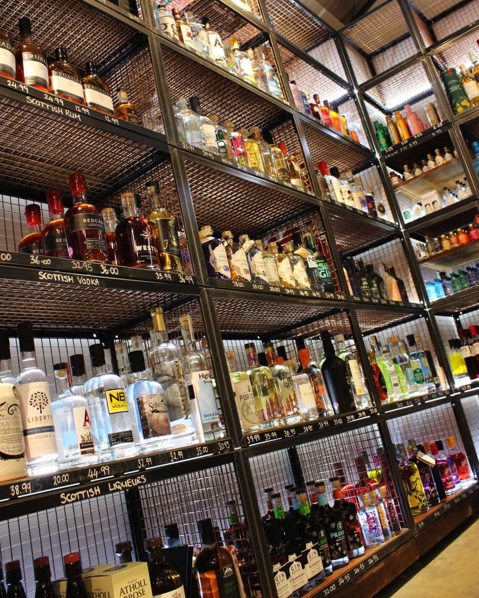 Shelving with bottles of alcohol on them